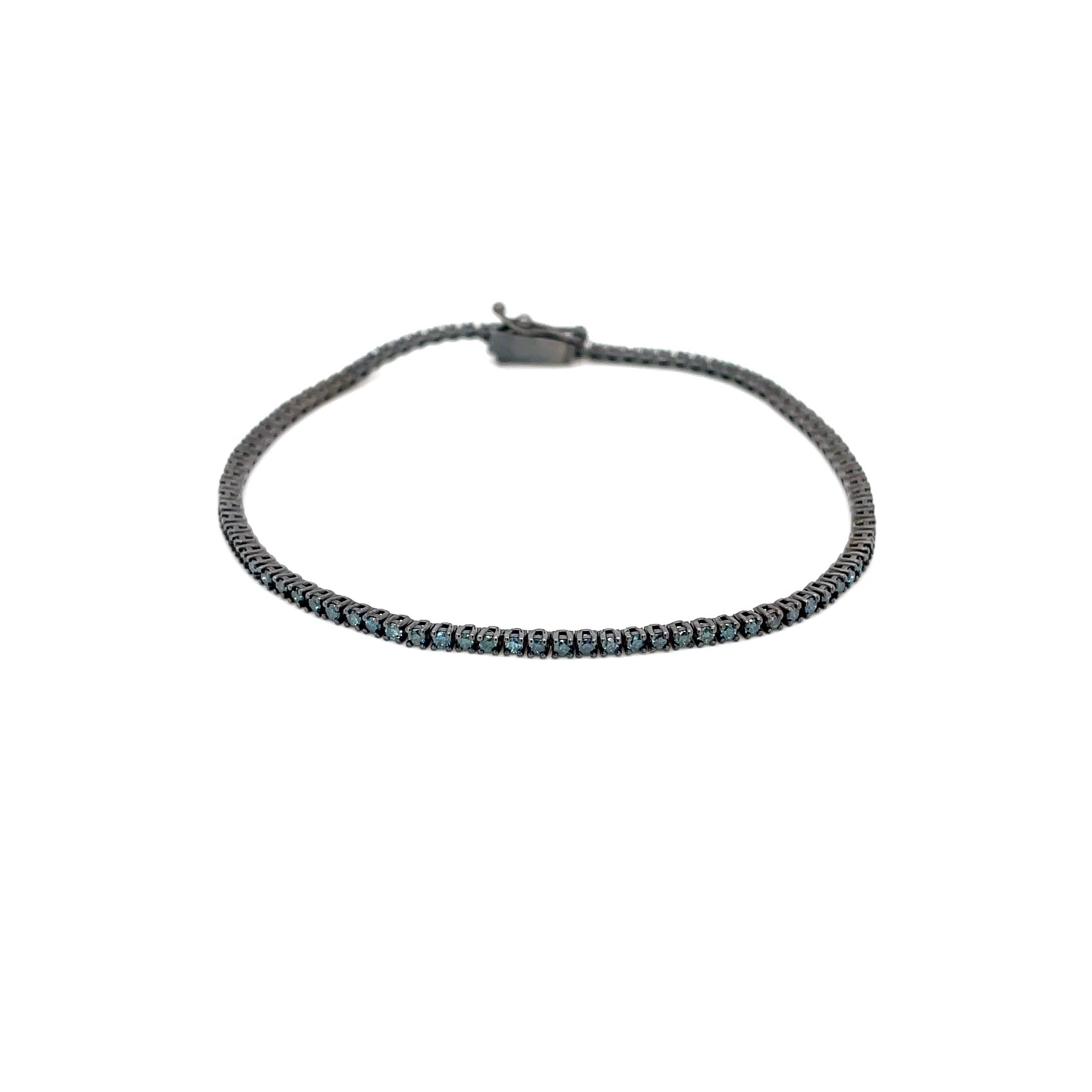 Златна тенис гривна със сини диаманти