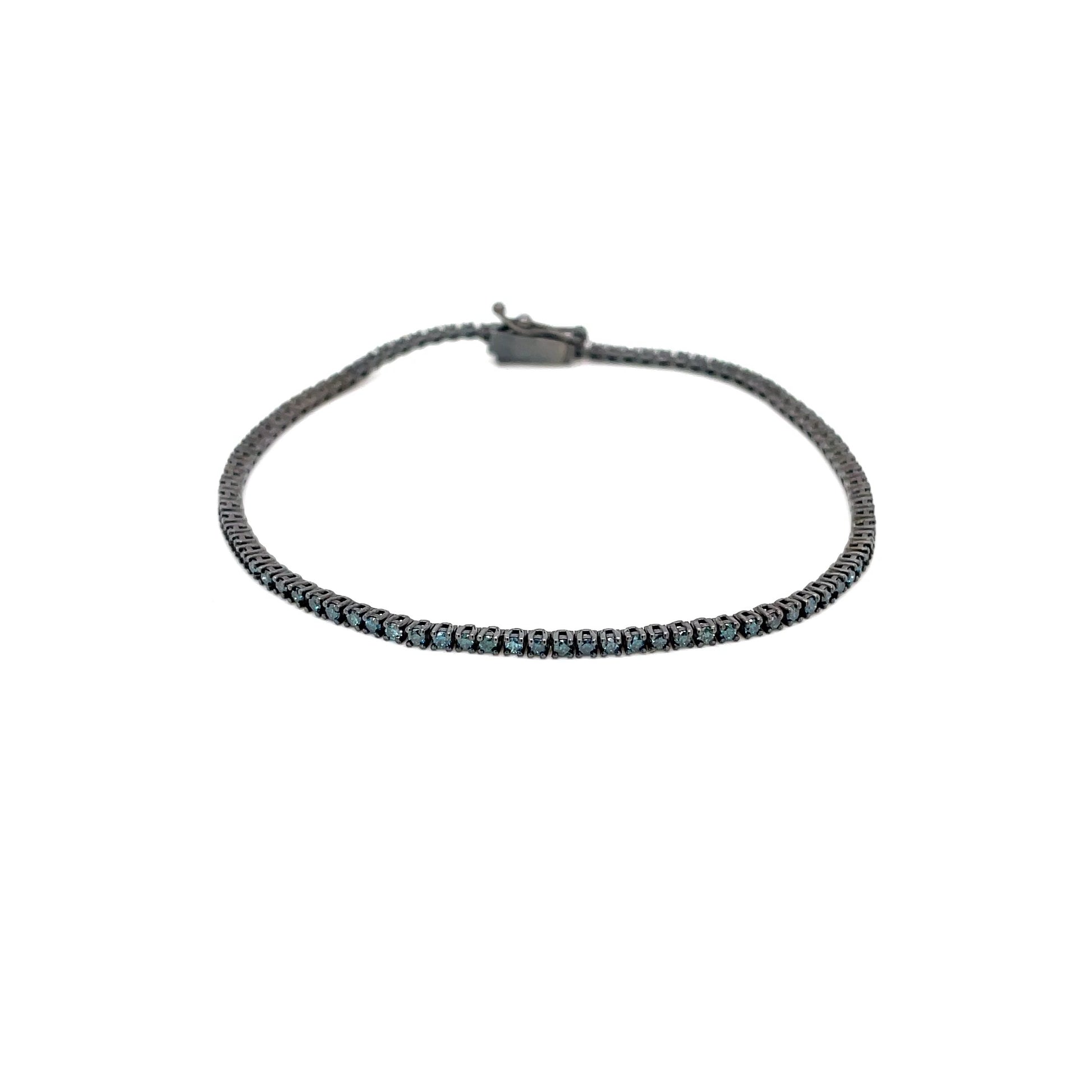 Златна тенис гривна със сини диаманти