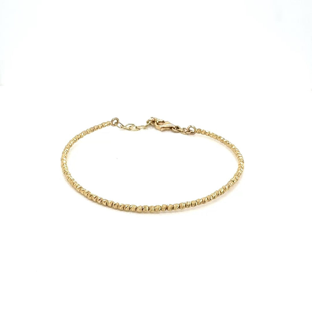 Гривна от лазерно оформени топчета 14 карата злато